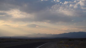 Clouds move above layers of terrain at sunset inside Death Valley National Park in Inyo County, California.
