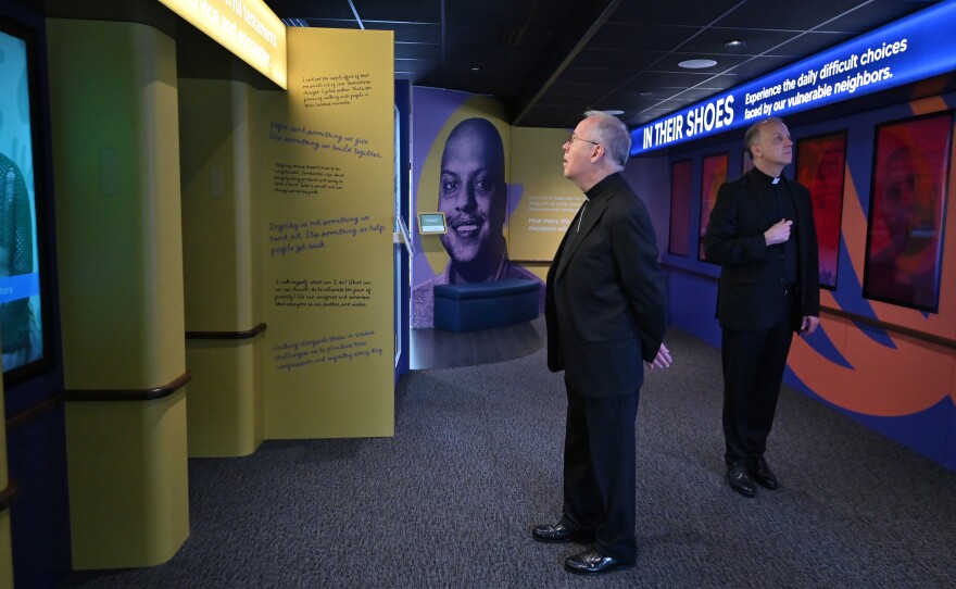 Scranton Bishop Joseph Bambera, left, and the Rev. Gerald Shantillo tour the People of Hope Museum, which was parked outside Nay Aug Park.