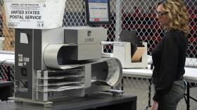 An Allegheny County Election worker demonstrates a machine used to count mail-in ballots at the elections warehouse in Pittsburgh, on April 18, 2024. Pennsylvania is seeing lots of action targeting gaps in its vote-by-mail laws. The problem is that it's in the courtroom and not the Legislature.<br>