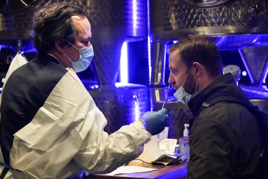 A medical professional administers a COVID-19 test to enter City Winery Tuesday, Nov. 24, 2020, in New York. City Winery will be the first restaurant in the nation to create a "100% COVID-tested space". The program will run every Tuesday and Wednesday evening for the remainder of 2020. (Frank Franklin II/AP)