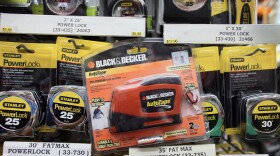 FILE-2009: Photo illustration, a Black & Decker tape measure is seen with Stanley tape measures November 3, 2009 in Miami, Florida. The tool makers Stanley Works and Black & Decker Corp. Announced that in an all-stock deal Stanley Works would pay $3.46 billion for rival Black & Decker. Stanley Black & Decker is now reporting it will close its last manufacturing facility in New Britain, which will result in 300 workers losing their jobs.
