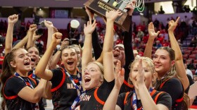 Girls high school basketball players inside an arena