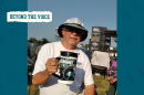 Man holds a mug at a music festival