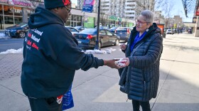 Sharee Clark hands out a Valentine gift on Public Square in Wilkes-Barre. Clark started the True Love Movement when she was feeling depressed in college.