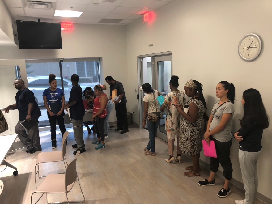 Parents line up to enroll their children for the 2018-19 school year. The online application for the 2019-20 school year opened Tuesday.