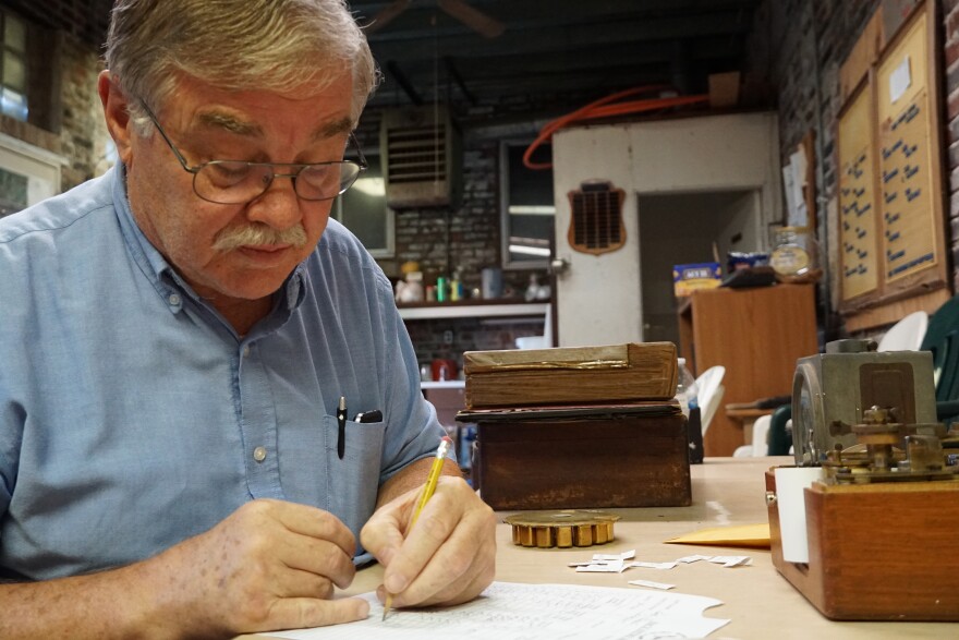 Kevin Sweeney helps register pigeons for an upcoming race at the Mount Pleasant Homing Pigeon Club in St. Louis.