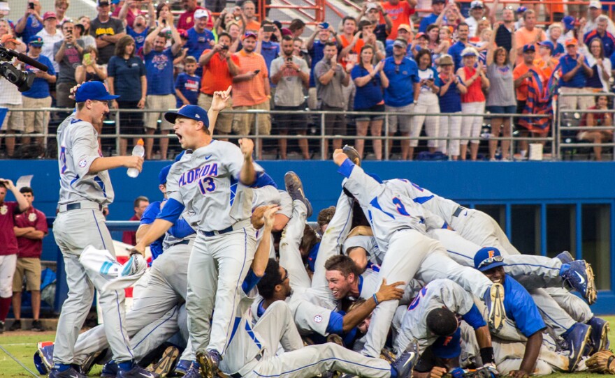 Kirby Snead celebrates Florida's win over FSU with his team on June 6.