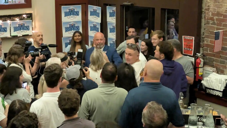 Bob Brooks speaks to campaign party gathering after declaring victory for the Democratic nomination for the 7th Congressional seat in Tuesday's primary election.