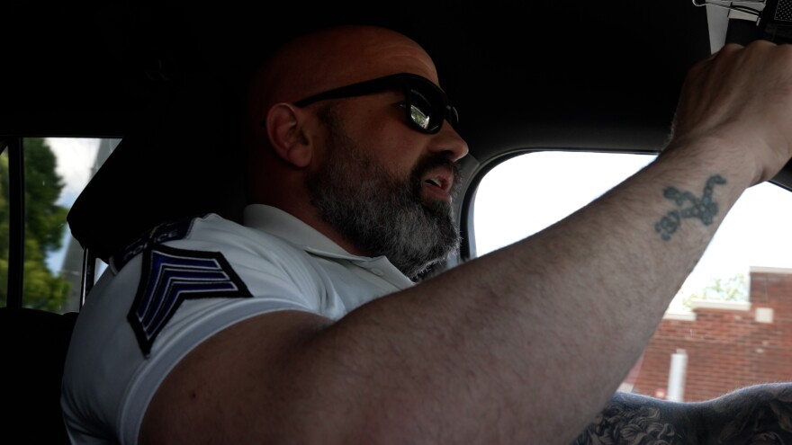 Sergeant Mark Fabris drives through downtown Bloomington. He said the downtown resource officers might not be able to pass people sleeping in parks without enforcement actions starting Wednesday.