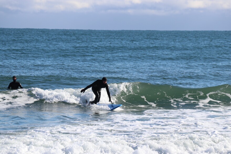 Rick Ganley rides a wave on North Beach in Hampton.