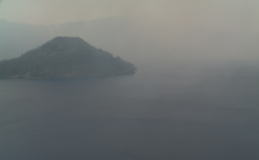 Crater Lake, enshrouded in smoke from nearby wildfires in the summer of 2017.