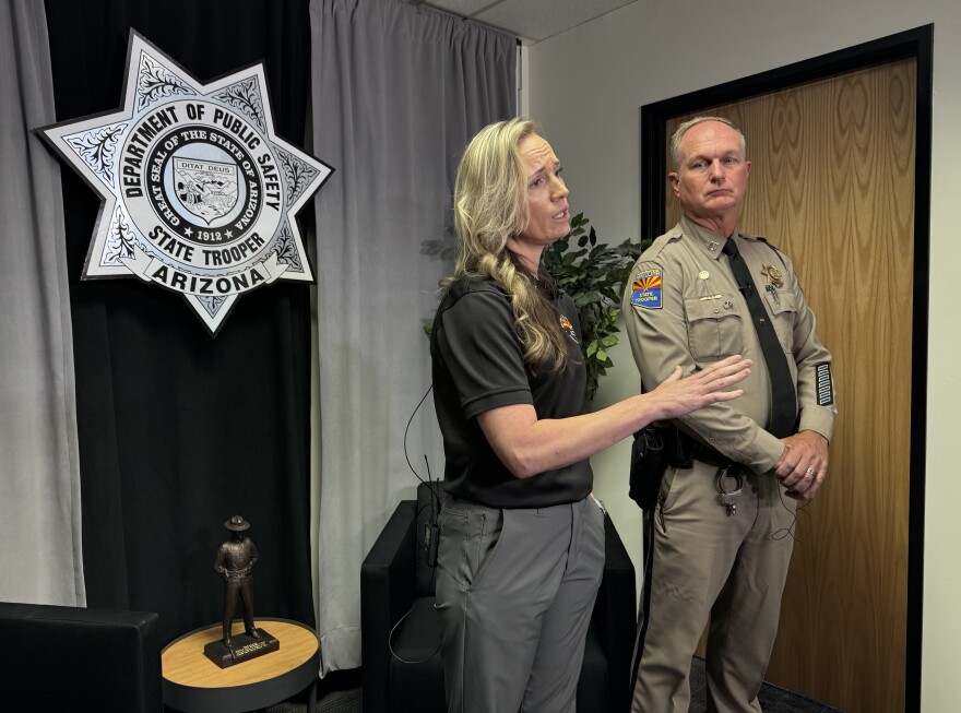 Captain Thomas Neve (right) and Kelsey Commisso, alerts coordinator, with the Arizona Department of Public Safety speak to media after the first successful Turquoise Alert on July 24, 2025.
