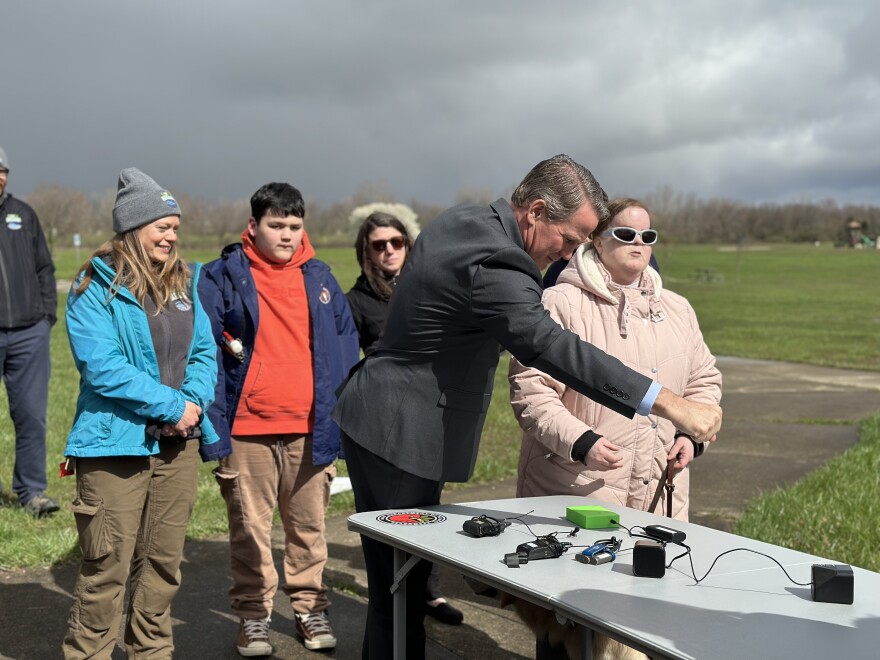 Lt. Gov. Jon Husted blocks the light sensor on a LightSound box at Alum Creek State Park.