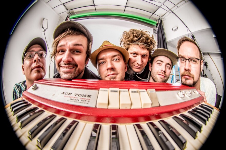 the band euforquestra posing for a photograph 