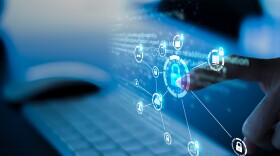 A blue screen with a lock icon in a circle, with a finger reaching to click it.