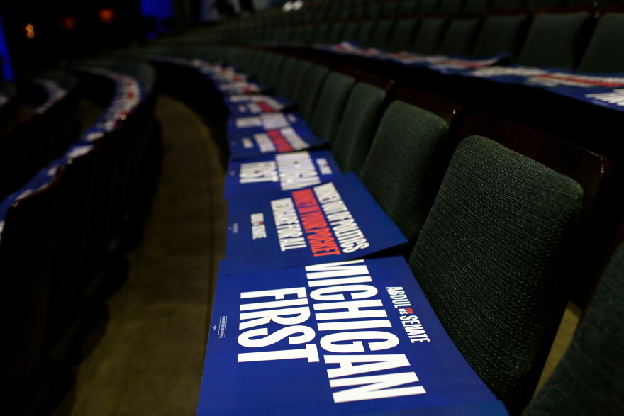 Michigan First signs lay on seats before a rally for Michigan Senate candidate Abdul El-Sayed Sunday, Oct. 25, 2026, in Grand Rapids, Mich. (AP Photo/Kristen Norman)