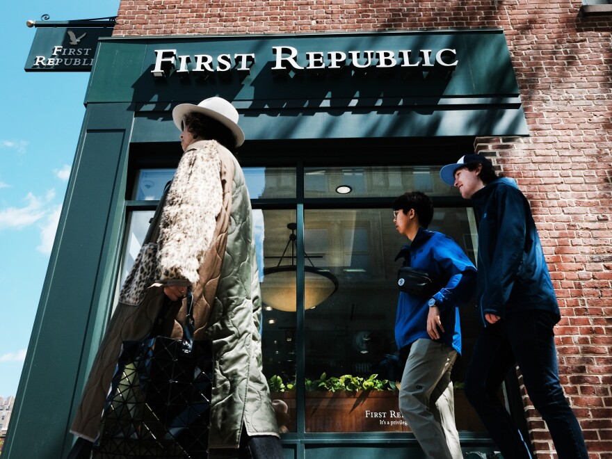 A person walks past a First Republic bank branch in Manhattan, New York City, on April 24, 2023. The lender was sold to JPMorgan Chase on Monday after a brief government takeover, becoming the third bank to fail this year.