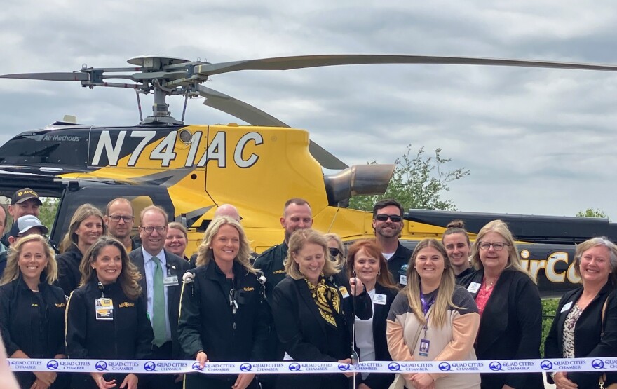 Dr. Denise Jamieson, center, vice president of medical affairs for University of Iowa Health Care, leads the ribbon cutting for the new AirCare helipad at 3385 Dexter Court, Davenport, on May 21, 2026.