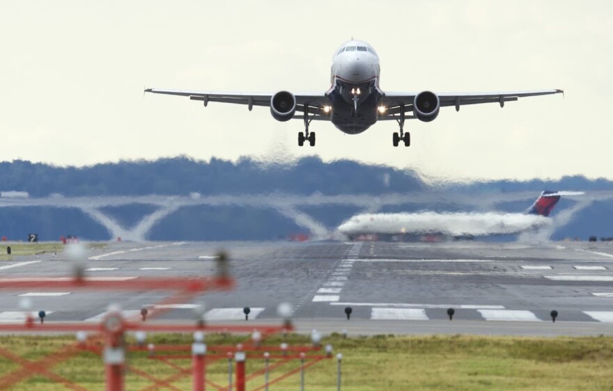 A U.S. Airways Airbus A320 airplane takes off from a runway at Ronald Reagan Washington National Airport in Arlington, Virginia, September 23, 2013. (Saul Loeb/AFP/Getty Images)