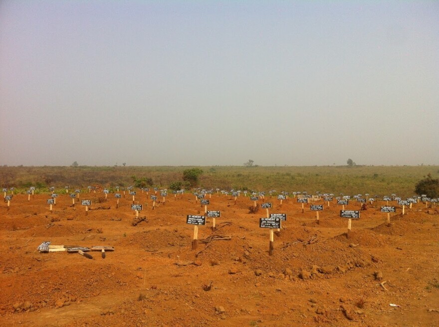 A graveyard down the road from the Port Loko Ebola Treatment Unit that Martha Phillips worked at, in northwestern Sierra Leone. Patients that died at the Ebola Treatment Unit, in their own homes, or at the hospital in town were buried in the cemetery.