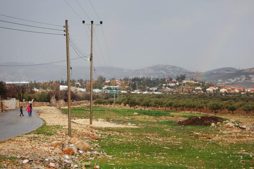 The Israeli settlement of Tekoa is just through an olive grove from the Palestinian town Tequa.