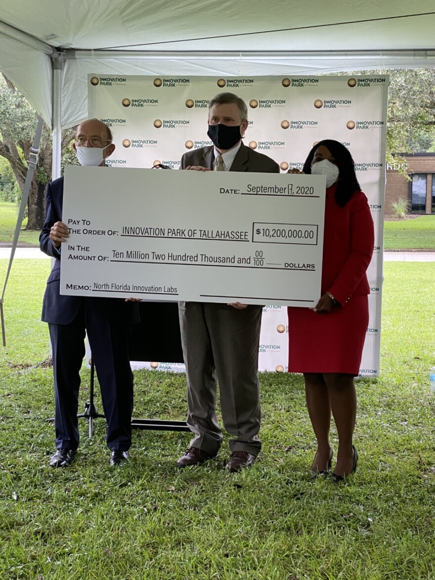 Check presentation, (L-R) U.S. Secretary of Commerce Wilbur Ross; Ron Miller, Executive Director, Leon County Research and Development Authority; Kimberly Moore, Chair, Leon County Research and Development Authority