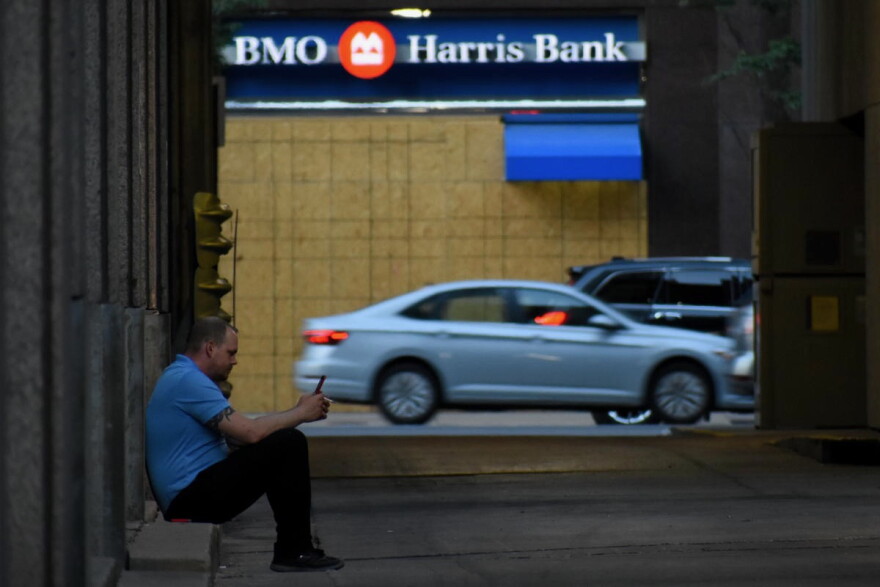 A worker in downtown Indianapolis takes a smoke break.