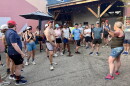 Mari Barlow (2nd from right) shares community running updates at the start of a Runaways event at Oxbow Brewing Co. in July.