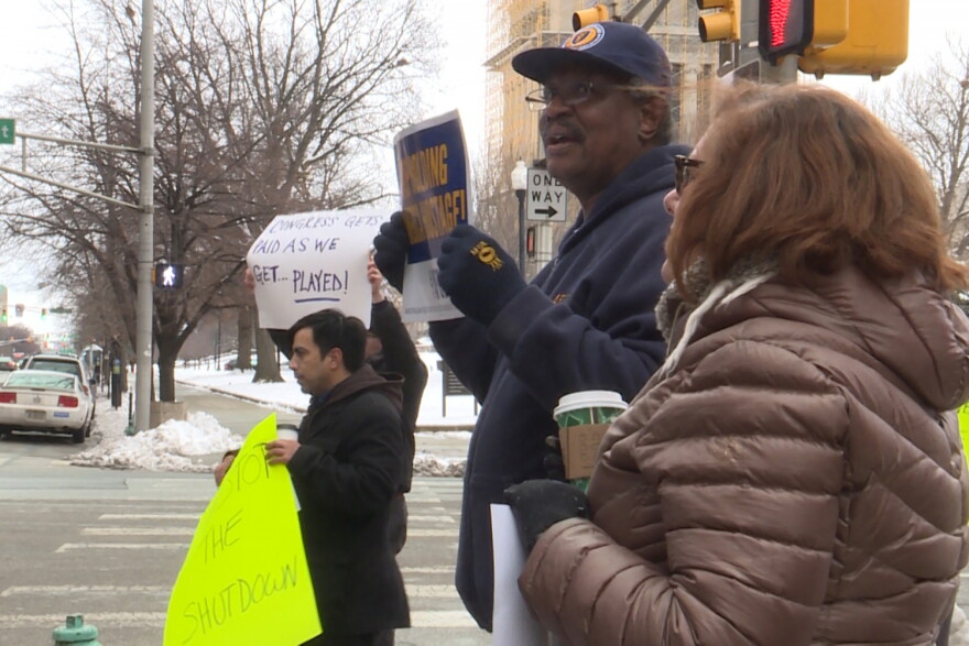 Members of the American Federation of Government Employees protest outside the Birch Bayh Federal building in Indianapolis.
