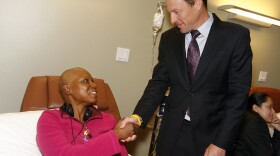Lance Armstrong greets cancer survivor Marie McKinney. Armstrong says he is leaving profesionnal cycling to continue his efforts to promote cancer research and raise awareness about the disease.