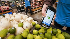  A worker scans produce at the Walmart Supercenter in North Bergen, New Jersey.