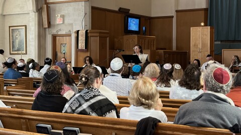 Congregation T'chiyah members listen to a sermon from Rabbi Alana Alpert during Rosh Hashanah services.