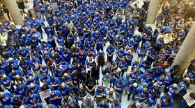 Indiana Right to Life rally attendees bow their heads in prayer inside the Statehouse on July 26, 2022.