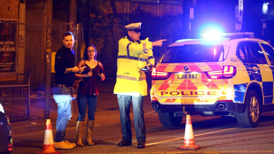 A street close to England's Manchester Arena is cordoned off Monday, as police confirm fatalities after a concert there by Ariana Grande. Media quote witnesses as saying there was an explosion and the audience ran for the exits.