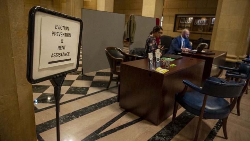 Iowa Legal Aid employees work at the Linn County Eviction Diversion Help Desk, which provides free legal assistance to residents facing eviction.