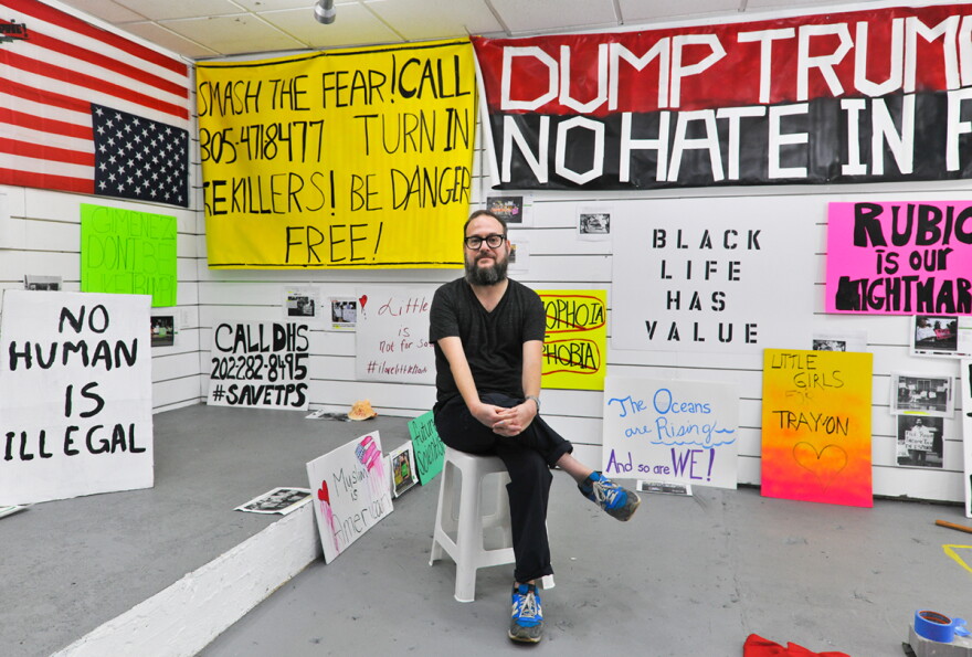 Jason Lazarus is the artist-in-residence at Mana Contemporary in downtown Miami. His installation "A Century of Dissent: Miami!" invites the public to recreate protest signs from the past 100 years of the city's history.