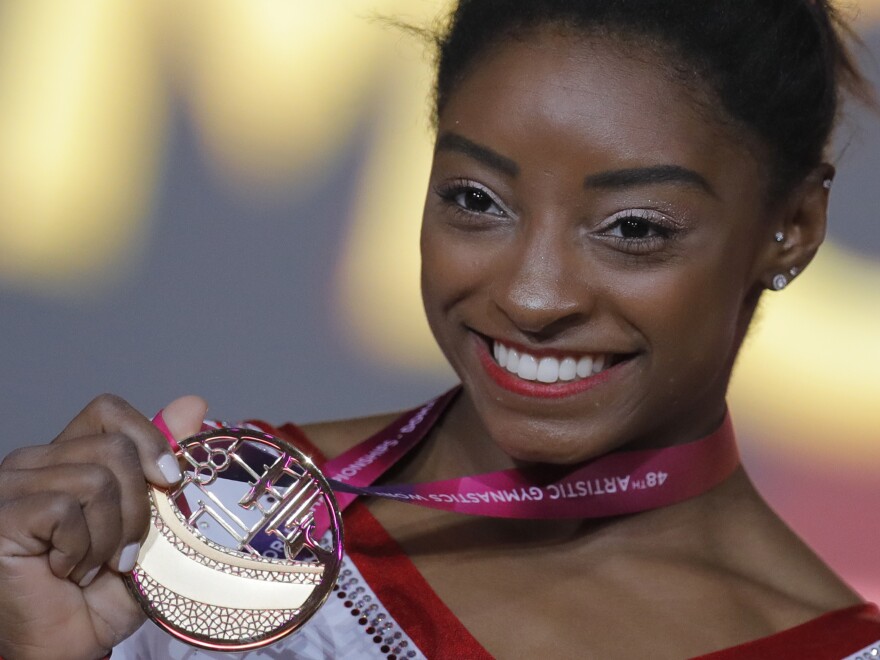 Simone Biles of the U.S. shows her gold medal after the women's vault final at the gymnastics World Championships in Doha, Qatar last week.