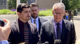 Michael DiMassa, left, and his lawyer, John Gulash, right, speak to reporters outside federal court in Hartford, Conn., Wednesday, May 31, 2023. DiMassa was sentenced to more than two years in prison for stealing $1.2 million from the city of West Haven, Conn.