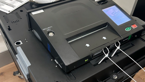 A vote tabulator with zero tape printed out during Saginaw's public accuracy test on Tuesday, Oct. 13, 2026. The tape signifies that no votes have been counted prior to the processing of ballots.