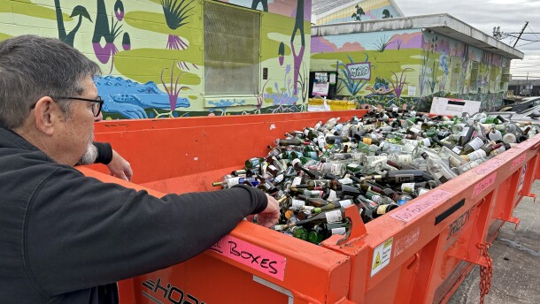 Kevin Horne, one of the volunteers who collects glass in Algiers Point, dumps a load of glass bottles into a large container at one of Glass Half Full’s facilities in New Orleans on Saturday, January 17, 2026.