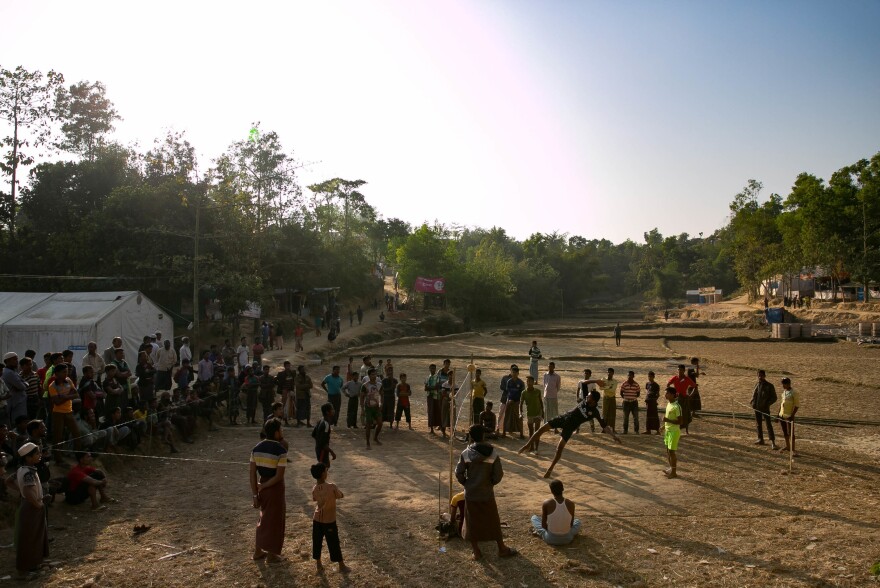 Refugees play a game that's a cross between volleyball and soccer in the Hakimpara camp.