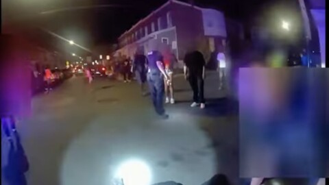 Screenshot from moment in body cam footage when officer 2 asks "did you shoot him?" and the officer on the ground, whose identity is blurred in the footage replies "yes."