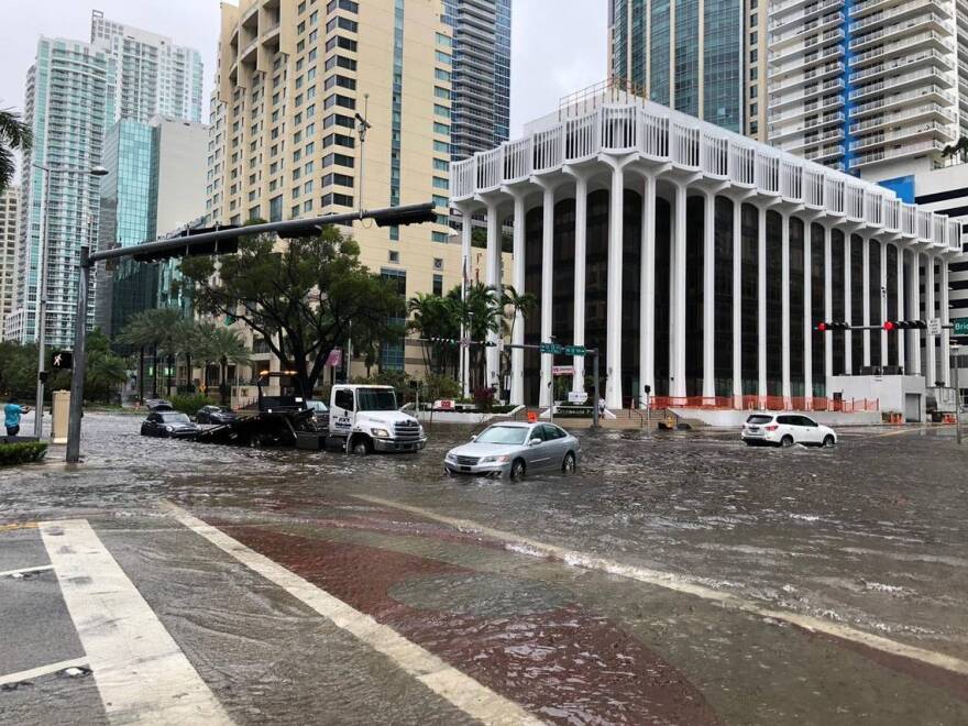 Climate change impacts aren’t news to resident of the Sunshine State. Pictured: Cars are stranded at the intersection of SW 13th Street and Brickell Avenue on Monday, November 9, 2020 with rains cause by Tropical Storm Eta. 