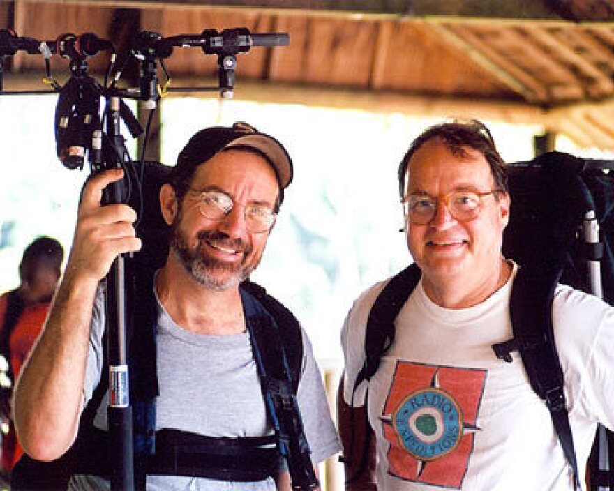 Bill McQuay and former NPR host and correspondent Alex Chadwick in 2002, after an elephant recording session at Dzanga Bai, in the Central African Republic.