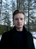 Young man in black coat.