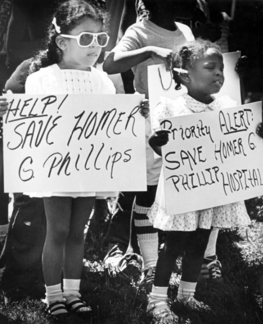 On August 17, 1980, Jolene Cotton (4) and Tiffany Hudson (2), join the ranks of demonstrators in a march that marked the one year closing of Homer G. Phillips Hospital. Photograph by John Dengler for the St. Louis Globe-Democrat.