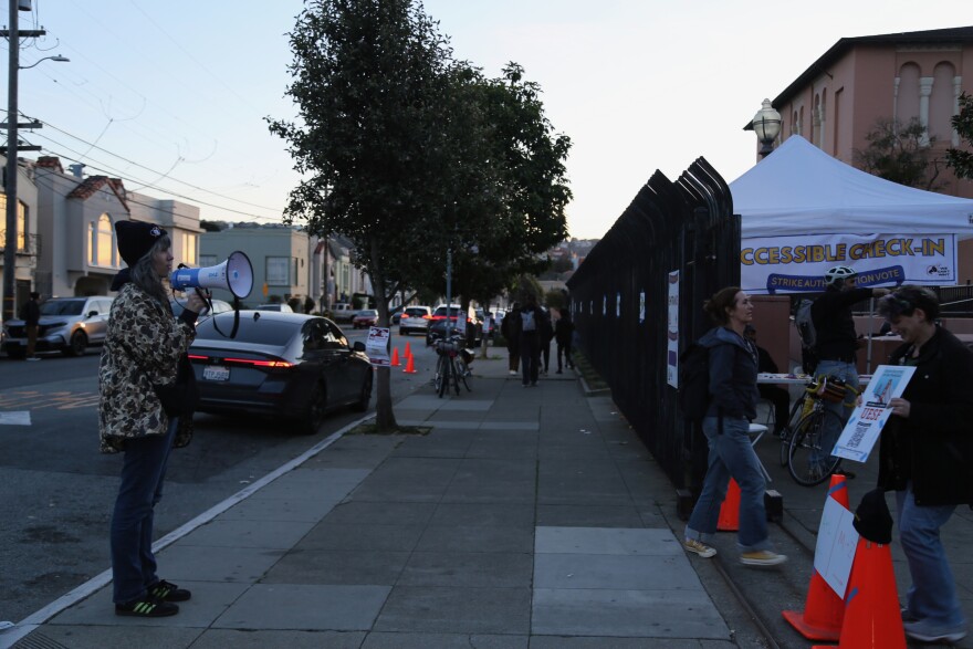 Tori Lanterman, a teacher at Longfellow Elementary, welcomes union members arriving to vote at Balboa High School on December 3.