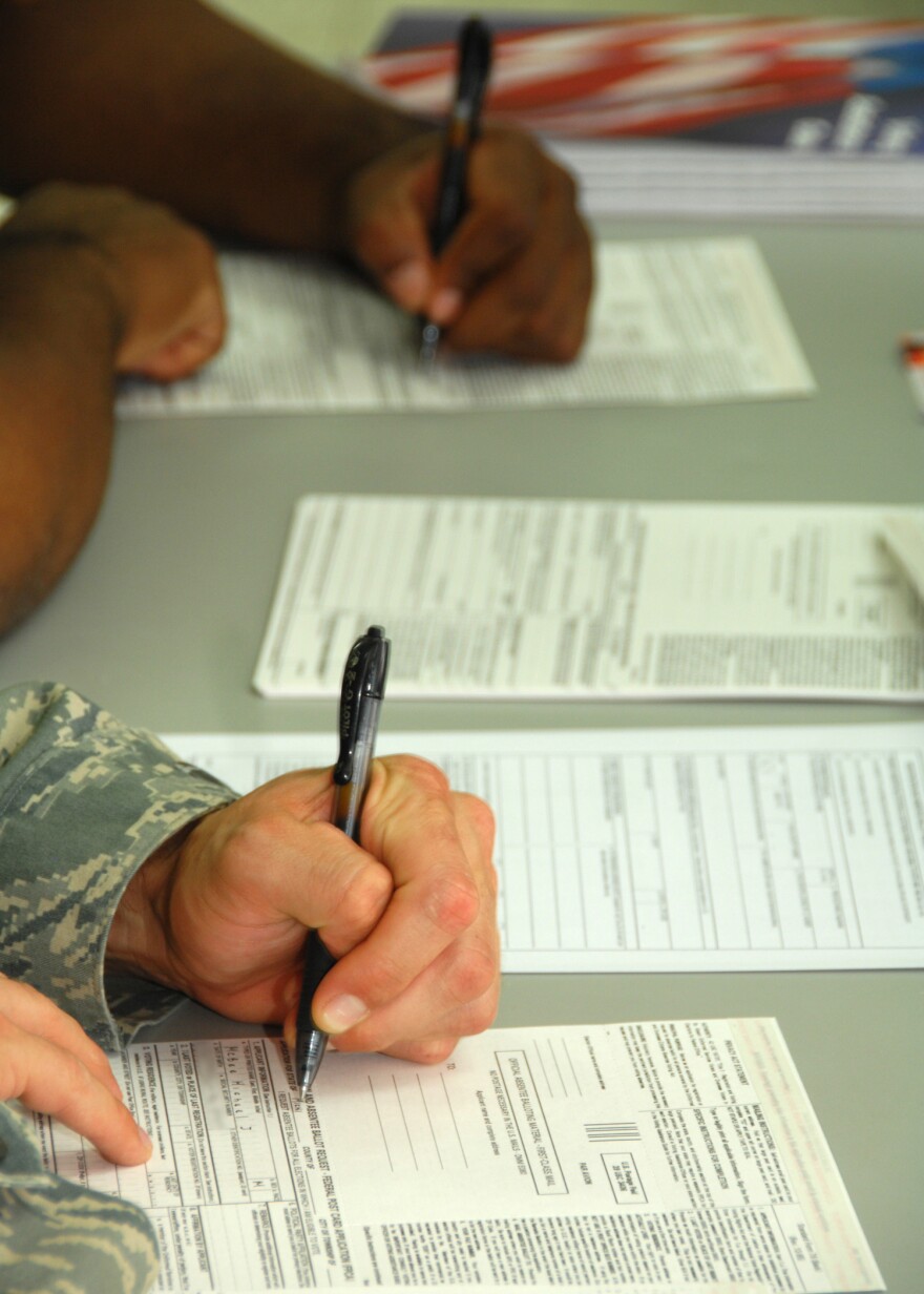Two people registering to vote.