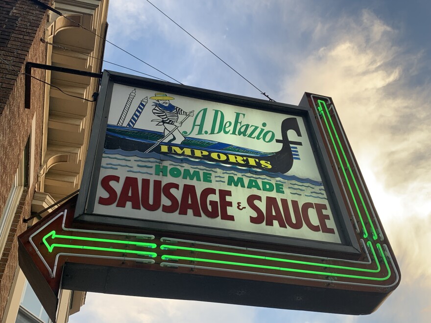 The illuminated sign for DeFazio's in Troy, NY