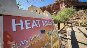 A sign warns visitors of extreme heat’s health risks at Capitol Reef National Park, June 28, 2026. Capitol Reef was one of several national parks or monuments in Utah that experienced their warmest summer on record this year.